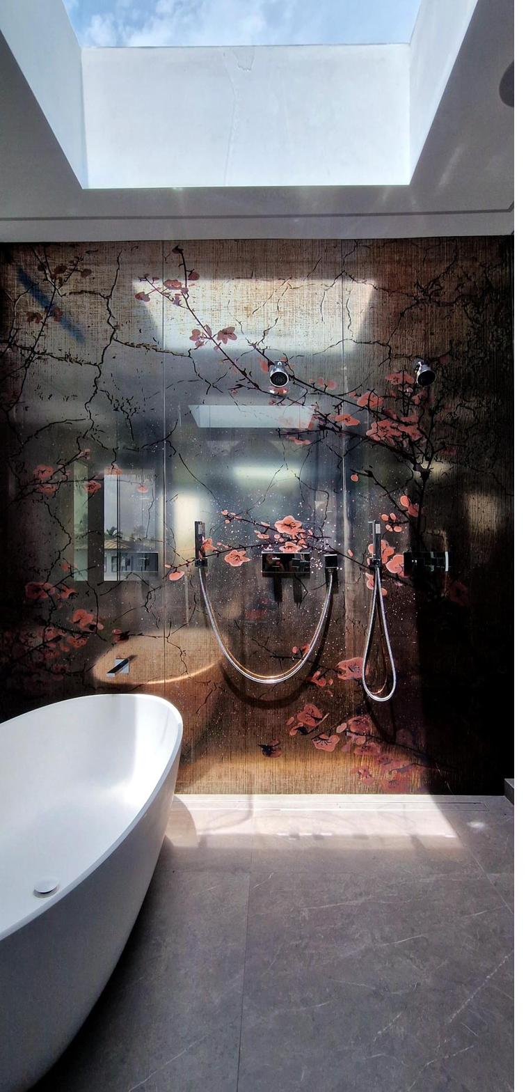 Spa-style bathroom with skylight and custom tile