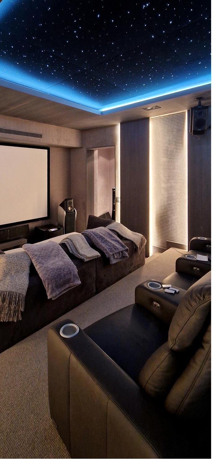 Private home theater with star-ceiling lighting